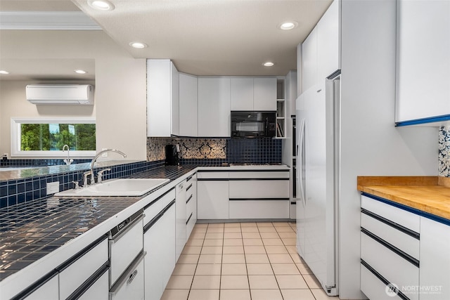 5222 Mahncke Rd SW, Longbranch, WA 98351 - kitchen featuring white appliances, backsplash, white cabinetry, a wall unit AC, and crown molding