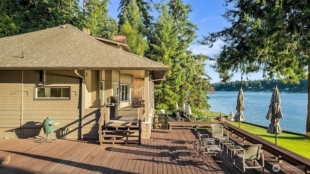 5222 Mahncke Rd SW, Longbranch, WA 98351 - wooden terrace featuring a water view