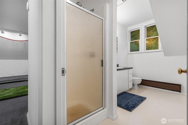 5222 Mahncke Rd SW, Longbranch, WA 98351 - bathroom featuring baseboard heating, a shower stall, and vanity