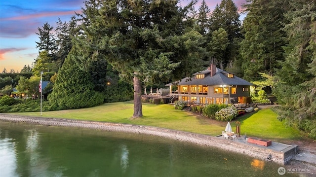 5222 Mahncke Rd SW, Longbranch, WA 98351 - rear view of property featuring a yard and a deck with water view