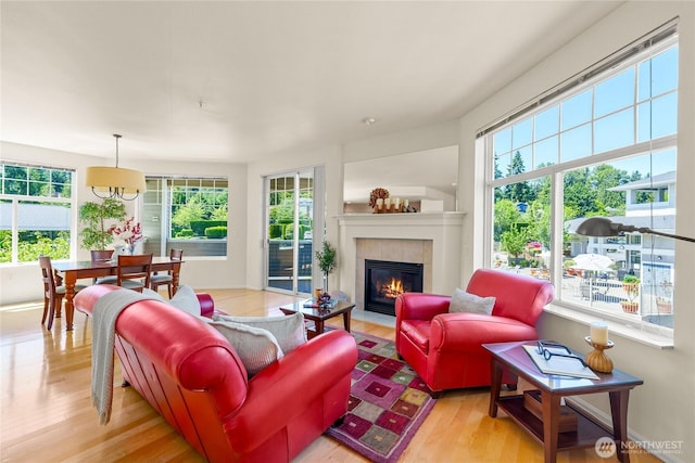 2244 SE 132nd Ave Unit B217, Bellevue, WA 98005 - living area featuring plenty of natural light, light wood-style flooring, and a tile fireplace