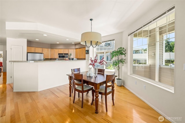 2244 SE 132nd Ave Unit B217, Bellevue, WA 98005 - dining area with light wood-type flooring and recessed lighting