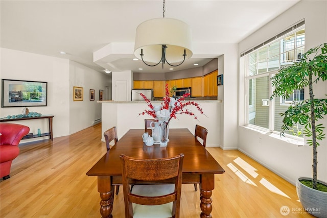2244 SE 132nd Ave Unit B217, Bellevue, WA 98005 - dining space featuring light wood-style floors, a chandelier, and recessed lighting