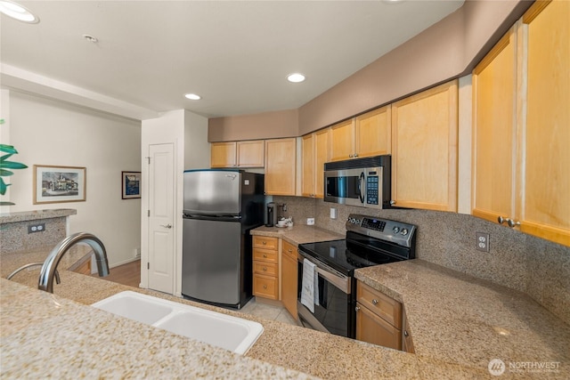2244 SE 132nd Ave Unit B217, Bellevue, WA 98005 - kitchen with stainless steel appliances, light brown cabinetry, backsplash, and recessed lighting