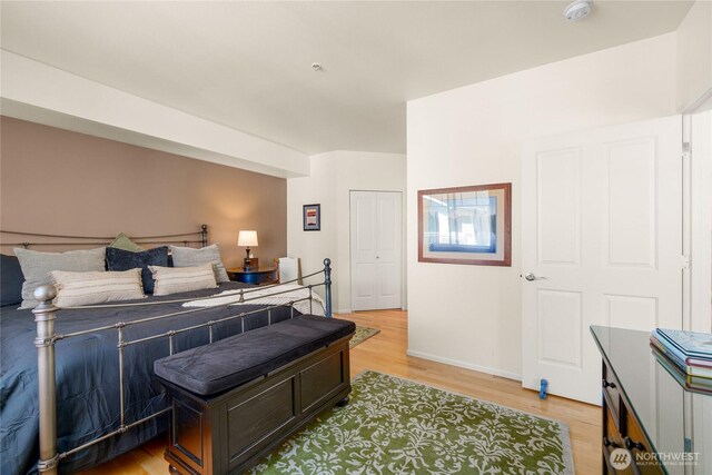 2244 SE 132nd Ave Unit B217, Bellevue, WA 98005 - bedroom with light wood-style flooring and baseboards
