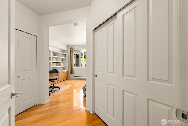 2244 SE 132nd Ave Unit B217, Bellevue, WA 98005 - home office featuring light wood finished floors and a baseboard radiator