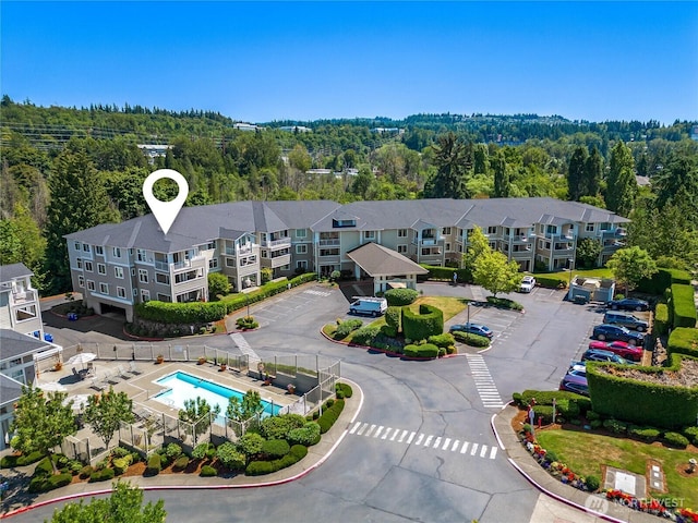 2244 SE 132nd Ave Unit B217, Bellevue, WA 98005 - drone / aerial view of a forest and a pool
