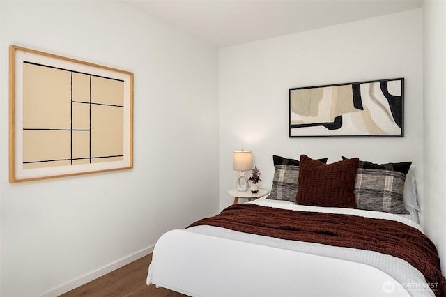 2610 E Yesler Way Unit A, Seattle, WA 98122 - bedroom featuring baseboards and wood finished floors