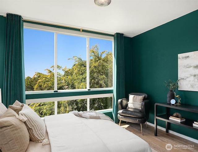 2610 E Yesler Way Unit A, Seattle, WA 98122 - bedroom with wood finished floors and multiple windows