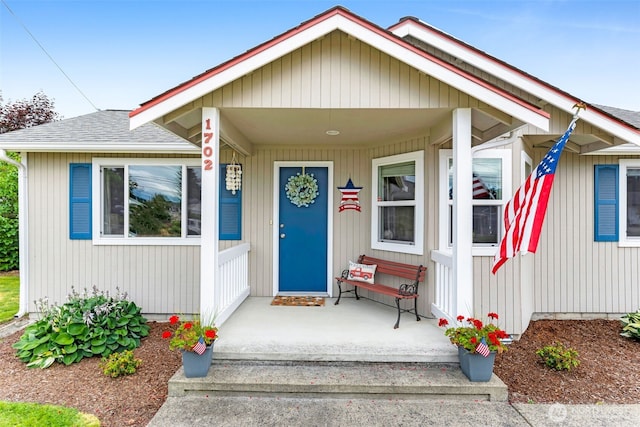 1702 7th Ave SW, Puyallup, WA 98371 - view of front of house featuring a shingled roof and a porch