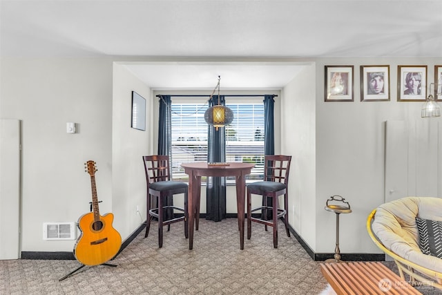 1702 7th Ave SW, Puyallup, WA 98371 - carpeted dining area featuring baseboards