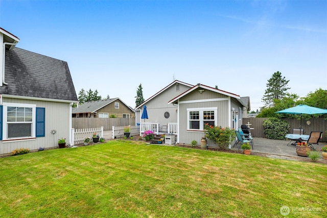 1702 7th Ave SW, Puyallup, WA 98371 - back of house with a patio and roof with shingles