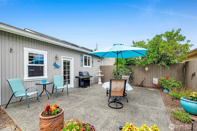 1702 7th Ave SW, Puyallup, WA 98371 - fenced backyard featuring a patio area and grilling area