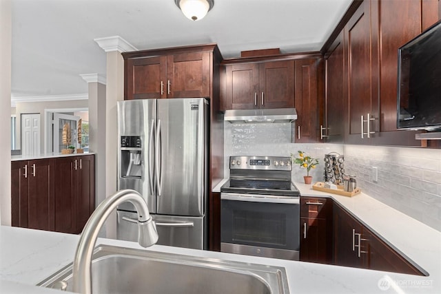 33020 10th Ave SW Unit M302, Federal Way, WA 98023 - kitchen featuring stainless steel appliances, under cabinet range hood, ornamental molding, backsplash, and dark brown cabinetry