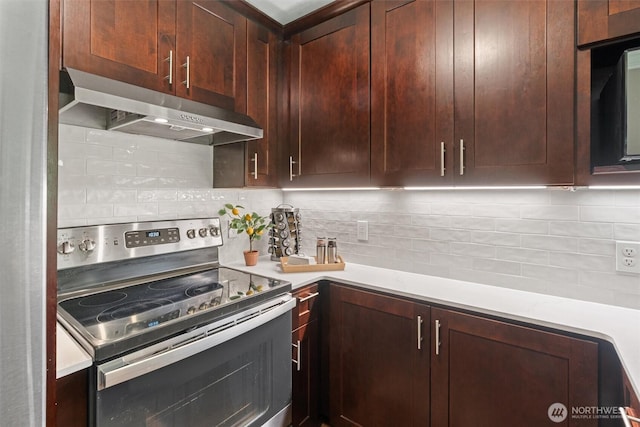 33020 10th Ave SW Unit M302, Federal Way, WA 98023 - kitchen with electric range, under cabinet range hood, backsplash, and light countertops