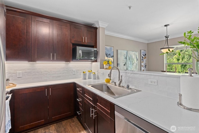 33020 10th Ave SW Unit M302, Federal Way, WA 98023 - kitchen featuring appliances with stainless steel finishes, light countertops, tasteful backsplash, decorative light fixtures, and crown molding