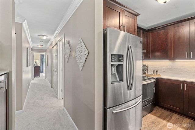 33020 10th Ave SW Unit M302, Federal Way, WA 98023 - kitchen with stainless steel appliances, crown molding, light countertops, backsplash, and dark brown cabinetry