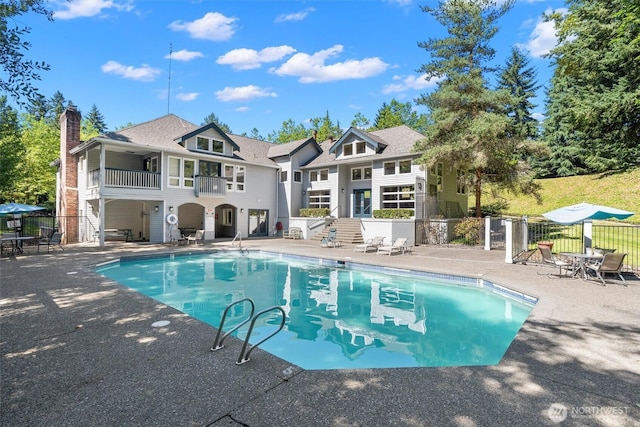 33020 10th Ave SW Unit M302, Federal Way, WA 98023 - rear view of house with a balcony, a patio, and a chimney