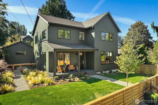 10419 41st Ave SW Unit A & B, Seattle, WA 98146 - back of property featuring a shingled roof, a fenced backyard, and a porch