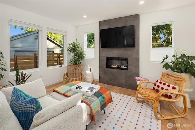 10419 41st Ave SW Unit A & B, Seattle, WA 98146 - living area with wood finished floors, a tile fireplace, and recessed lighting