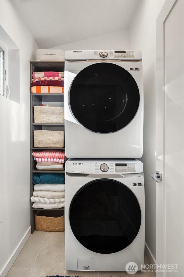 10419 41st Ave SW Unit A & B, Seattle, WA 98146 - laundry area featuring stacked washing machine and dryer and tile patterned flooring