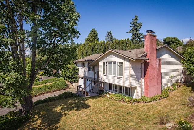 2120 Niagara Dr, Bellingham, WA 98229 - rear view of property featuring a chimney, a yard, and a garage