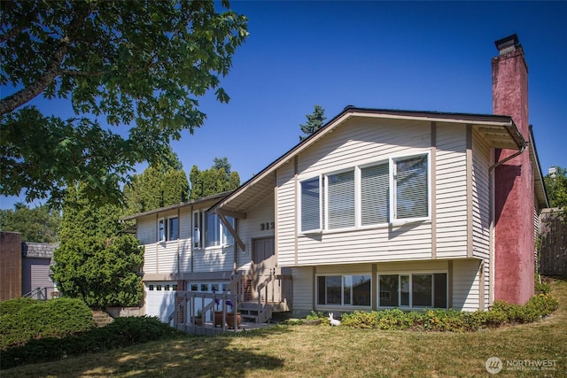 2120 Niagara Dr, Bellingham, WA 98229 - rear view of property with a chimney, a lawn, and an attached garage