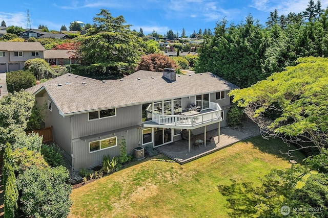 1823 121st Ave SE, Bellevue, WA 98005 - rear view of house with a patio area, a yard, a deck, a shingled roof, and a chimney