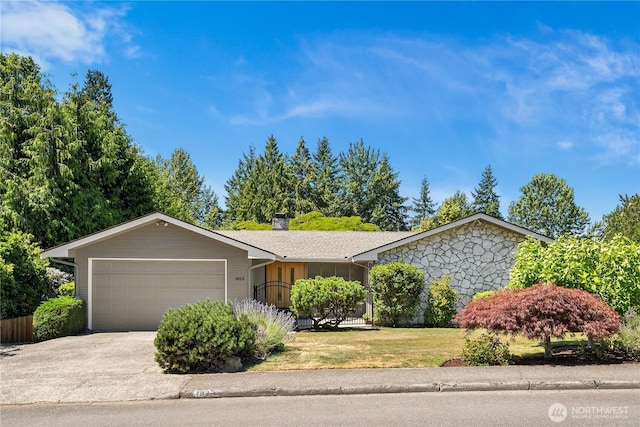 1823 121st Ave SE, Bellevue, WA 98005 - ranch-style house with an attached garage, a chimney, concrete driveway, and a front yard