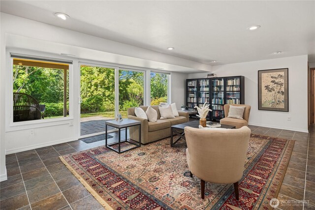 1823 121st Ave SE, Bellevue, WA 98005 - living room featuring plenty of natural light, dark stone finish floors, and recessed lighting