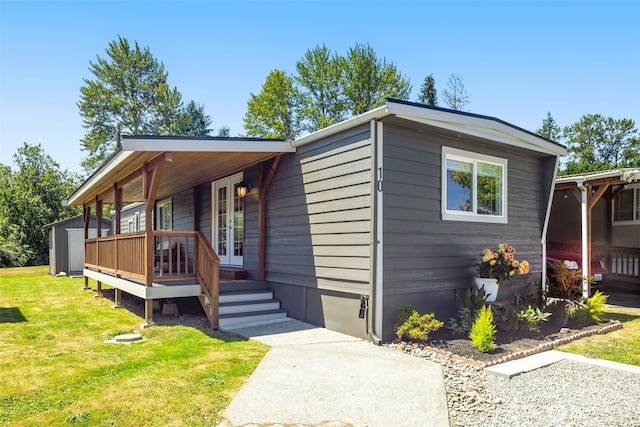 8730 206th St SE Unit 10, Snohomish, WA 98296 - manufactured / mobile home featuring a front lawn, a shed, and a porch