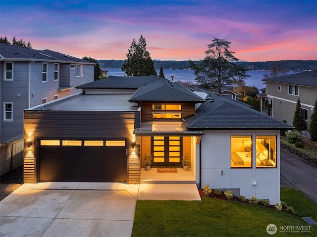 240 W Lake Sammamish Pkwy SE, Bellevue, WA 98008 - view of front of house with driveway, an attached garage, a lawn, and roof with shingles