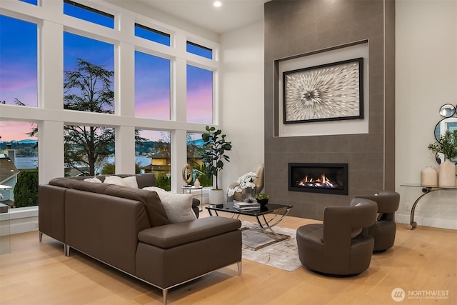 240 W Lake Sammamish Pkwy SE, Bellevue, WA 98008 - living room featuring a high ceiling, wood finished floors, a tile fireplace, and recessed lighting