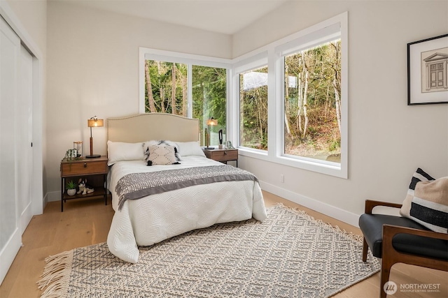240 W Lake Sammamish Pkwy SE, Bellevue, WA 98008 - bedroom with wood finished floors and a closet