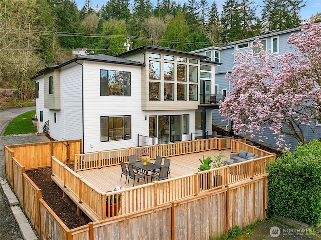240 W Lake Sammamish Pkwy SE, Bellevue, WA 98008 - back of property with a deck, a fenced backyard, and outdoor dining space