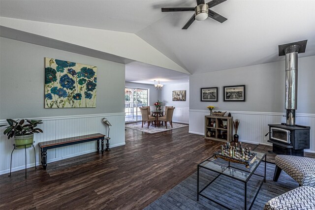 18920 217th Ave E, Orting, WA 98360 - living area featuring a wood stove, ceiling fan, wainscoting, lofted ceiling, and wood finished floors