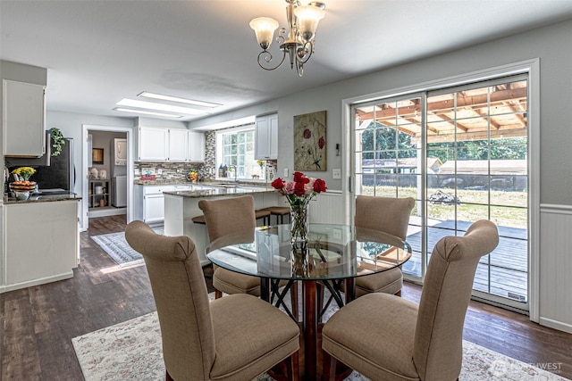 18920 217th Ave E, Orting, WA 98360 - dining room featuring a chandelier and dark wood finished floors