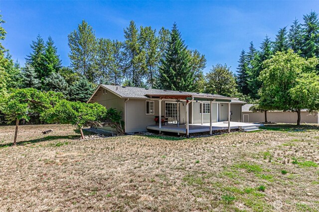18920 217th Ave E, Orting, WA 98360 - rear view of property with a patio and a lawn