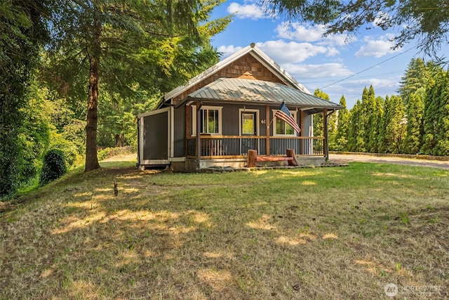 610 Westlake Ave, Morton, WA 98356 - view of front of house with a porch, a front yard, a metal roof, and a standing seam roof
