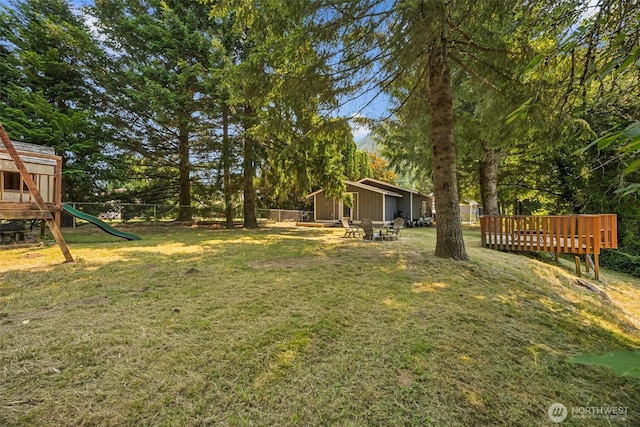610 Westlake Ave, Morton, WA 98356 - view of yard with a playground, view of wooded area, and a deck