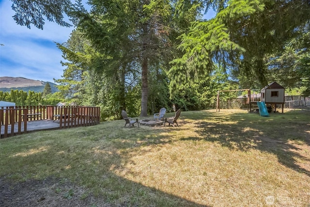 610 Westlake Ave, Morton, WA 98356 - view of yard with a playground, a fire pit, and a deck with mountain view