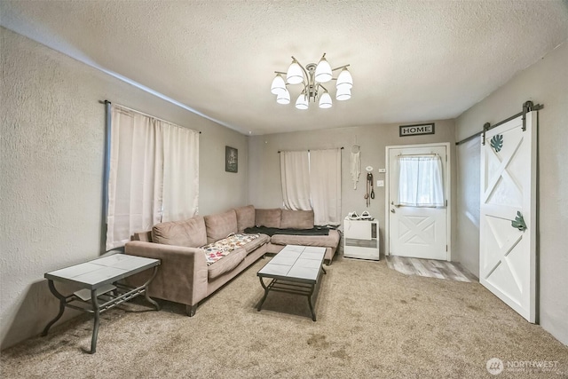 610 Westlake Ave, Morton, WA 98356 - carpeted living room featuring a barn door, a textured ceiling, a chandelier, and a textured wall