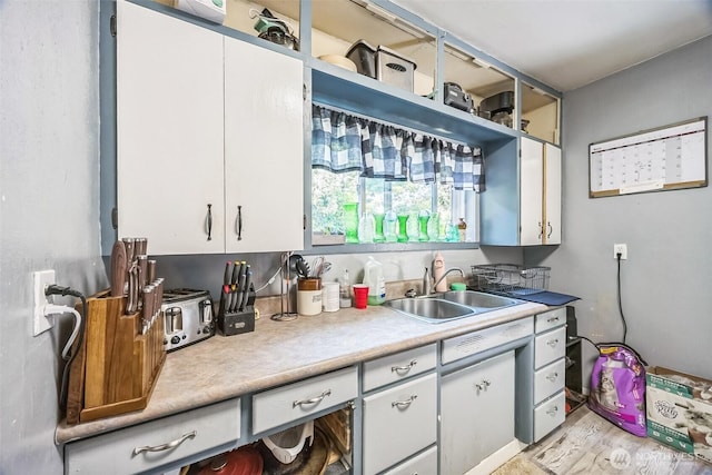 610 Westlake Ave, Morton, WA 98356 - kitchen with light countertops, white cabinetry, light wood-style floors, and open shelves
