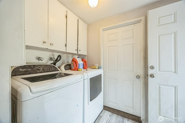 610 Westlake Ave, Morton, WA 98356 - washroom with washer and dryer, cabinet space, and light wood-type flooring