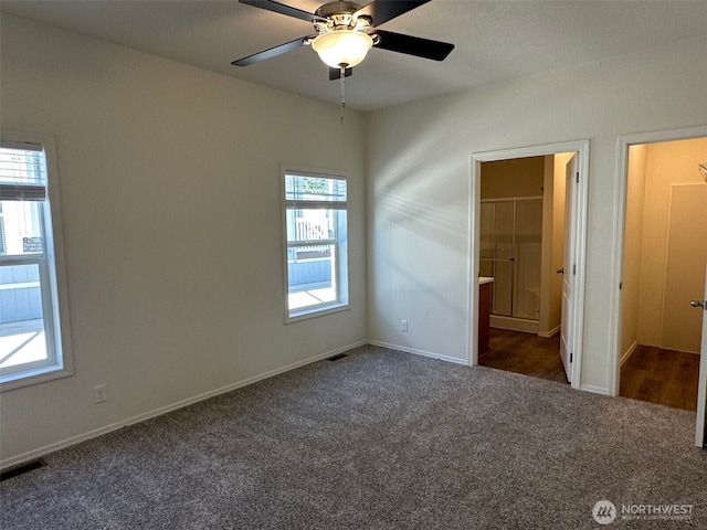 2101 S 324th St Unit 228, Federal Way, WA 98003 - unfurnished bedroom featuring carpet, ensuite bath, and a ceiling fan