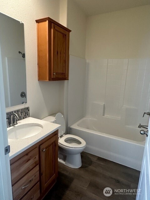 2101 S 324th St Unit 228, Federal Way, WA 98003 - bathroom featuring vanity, wood finished floors, and shower / washtub combination