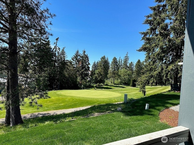2101 S 324th St Unit 228, Federal Way, WA 98003 - view of property's community with a lawn, view of golf course, and view of wooded area