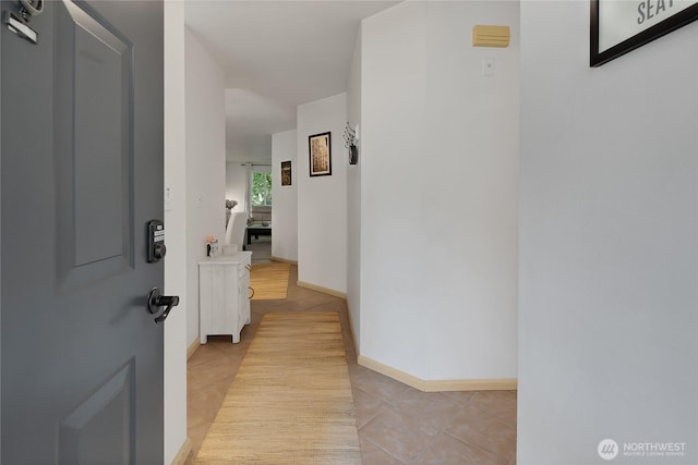 2300 Jefferson Ave NE Unit F-126, Renton, WA 98056 - hall featuring light tile patterned floors and baseboards