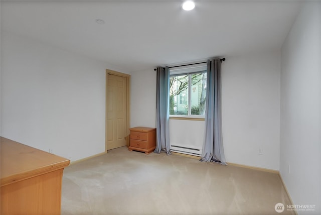 2300 Jefferson Ave NE Unit F-126, Renton, WA 98056 - spare room with light carpet and a baseboard radiator