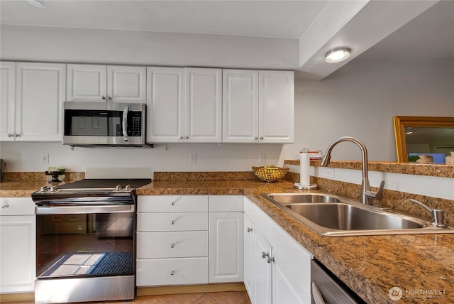 2300 Jefferson Ave NE Unit F-126, Renton, WA 98056 - kitchen featuring stainless steel appliances, white cabinets, and light tile patterned flooring